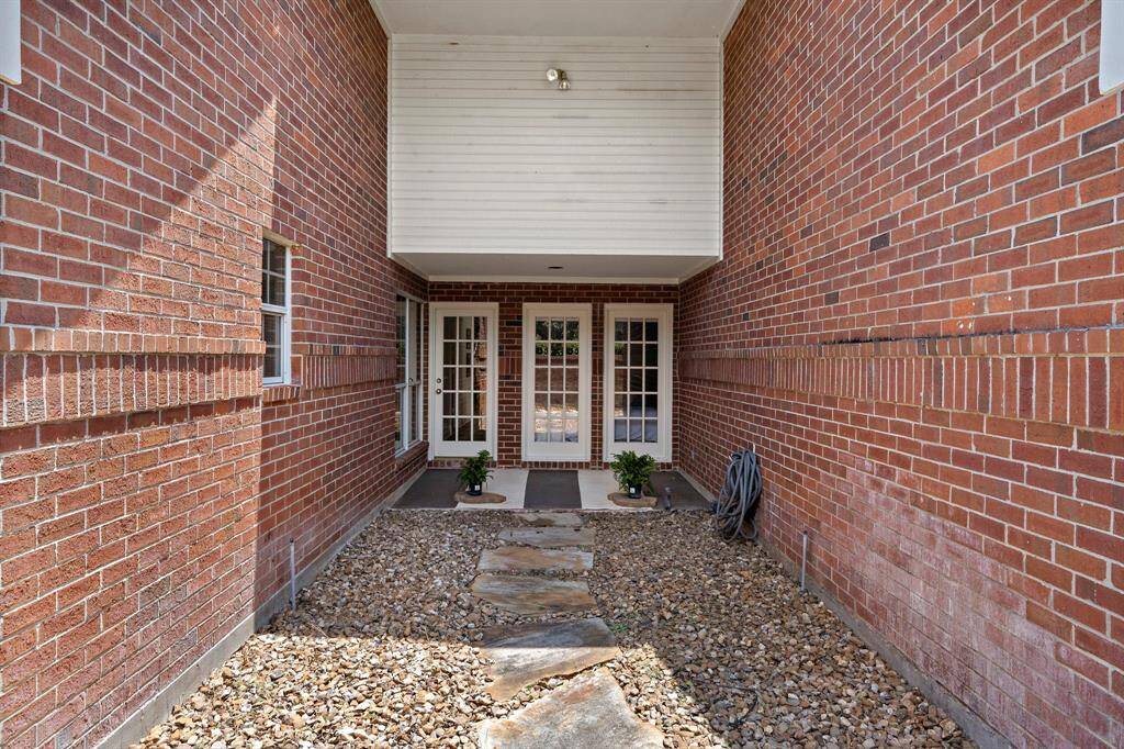 This courtyard is outside the primary suite.