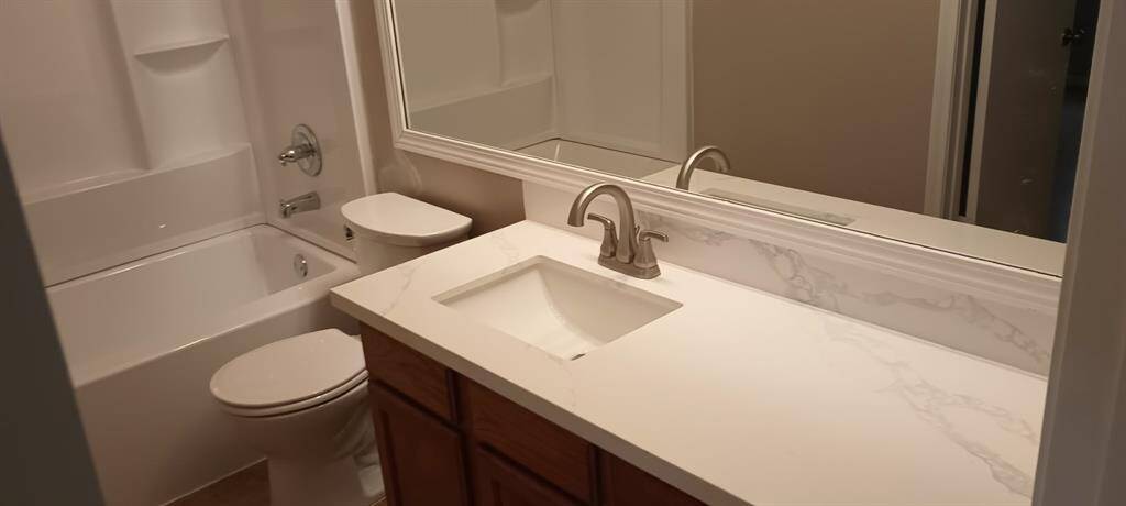 New Granite countertop and sink, New toilet, and all new Shower and bath tub combo