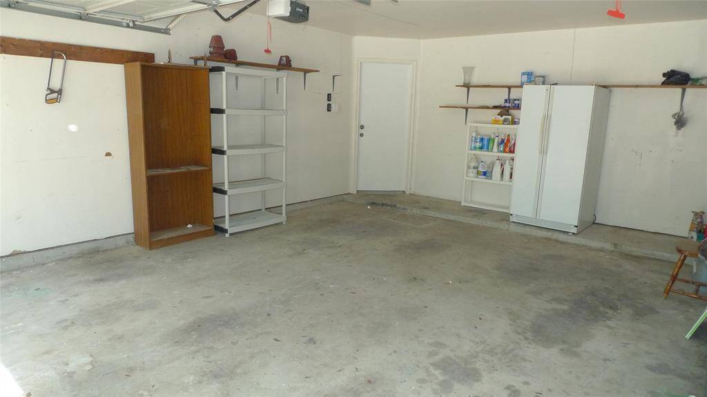 Big 2 car garage with extra refrigerator included
