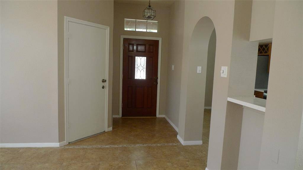 Entrance opens up into living room and Dining area