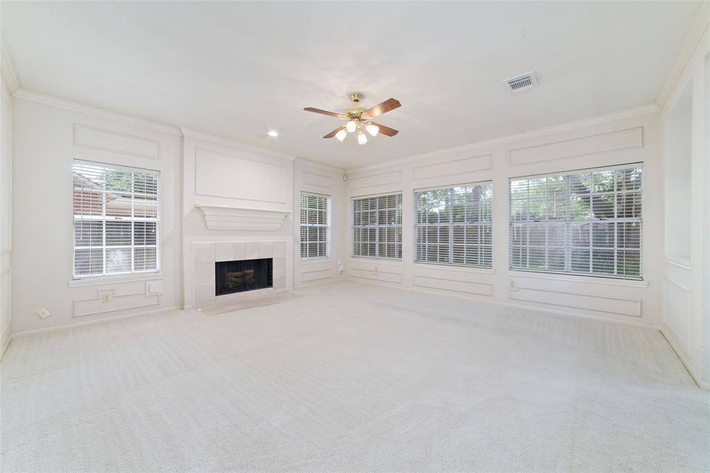 Bright gathering room with a gas log fireplace, perfect for cozy evenings.