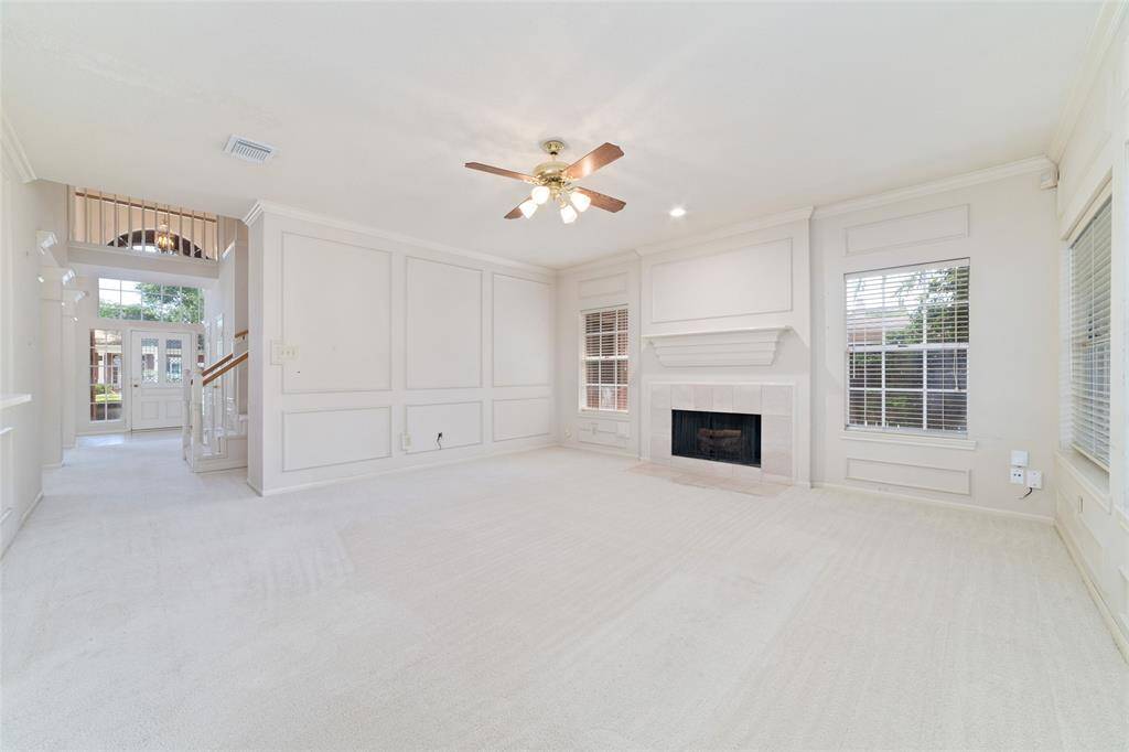 Inviting gathering room with views of the front entrance and elegant formal areas.