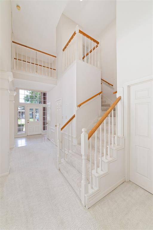Stairs lead up to secondary bedrooms