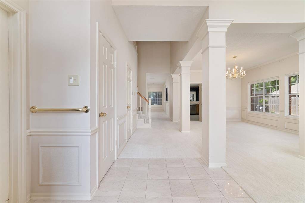 Welcome home! Step into the foyer, where elegant dining and living rooms await on your right, while the luxurious primary suite beckons on your left.