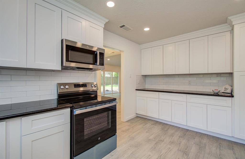 Bright kitchen with brand new stainless steel appliances and lots of storage space!