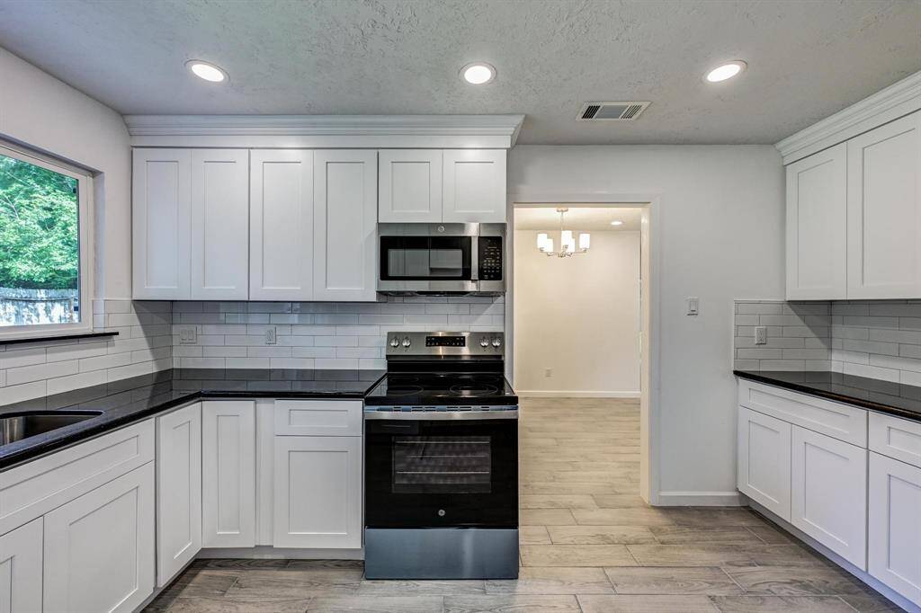 Soft close custom cabinets and black pearl granite countertops