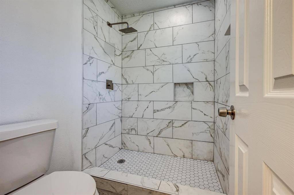 View of the renovated primary bathroom shower