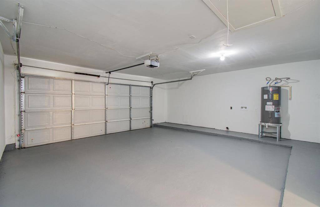 Garage has automated doors and hook-ups for washer and dryer
