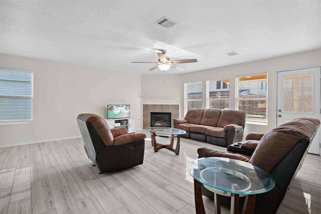 aother view of the living area with fireplace feature