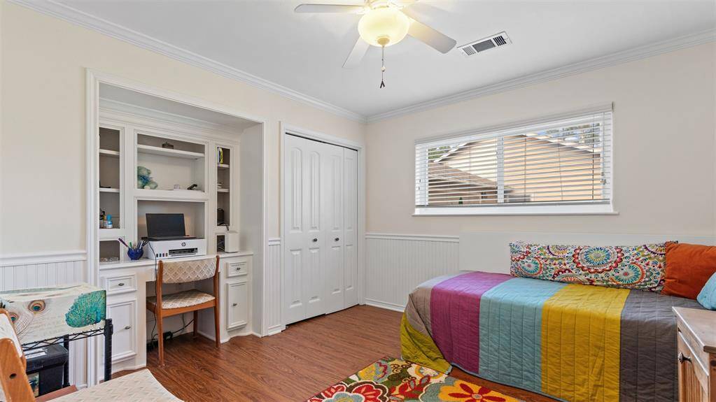 Bedroom with custom desk area.
