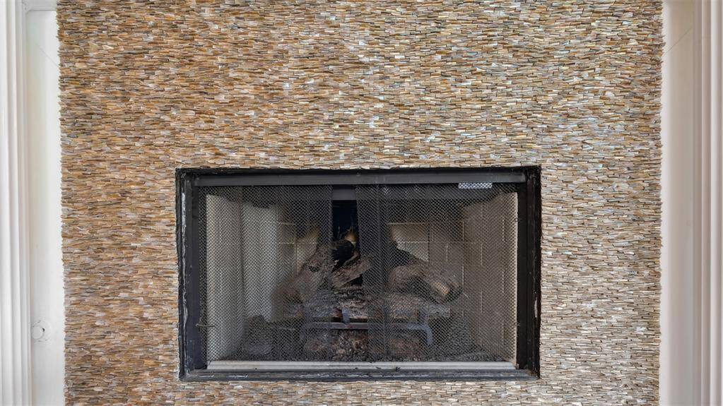 Custom mother-of-pearl fireplace just sparkles in the natural light!
