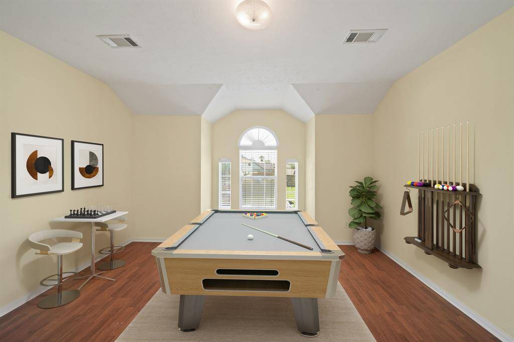 Virtually Staged: Unwind after a long day in this incredible Primary Bedroom! It boasts laminate floors, plenty of natural light thanks to the large windows, and a ceiling fan.
