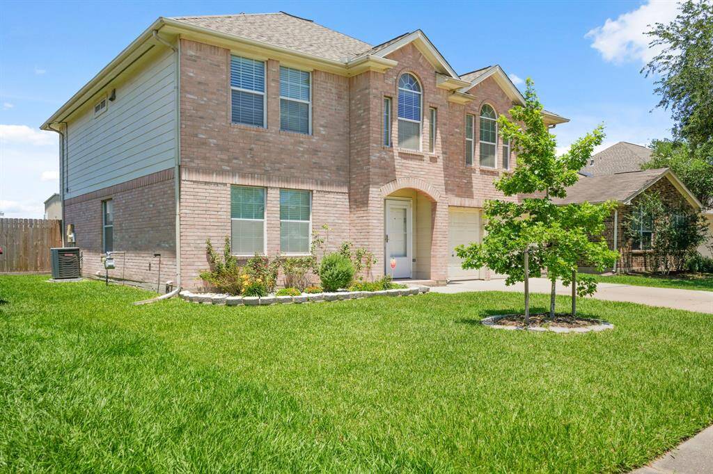 This captivating home boasts a grand curbside appeal - highlighting the beautiful brick, and array of windows.