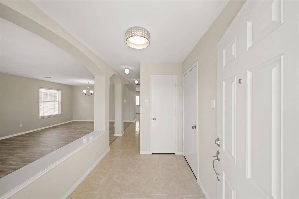 Virtually Staged: The living and dining areas are seamlessly connected, and feature laminate floors.