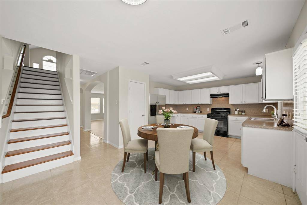 Virtually Staged: This kitchen has generous space, and has plenty of cabinetry for storage.
