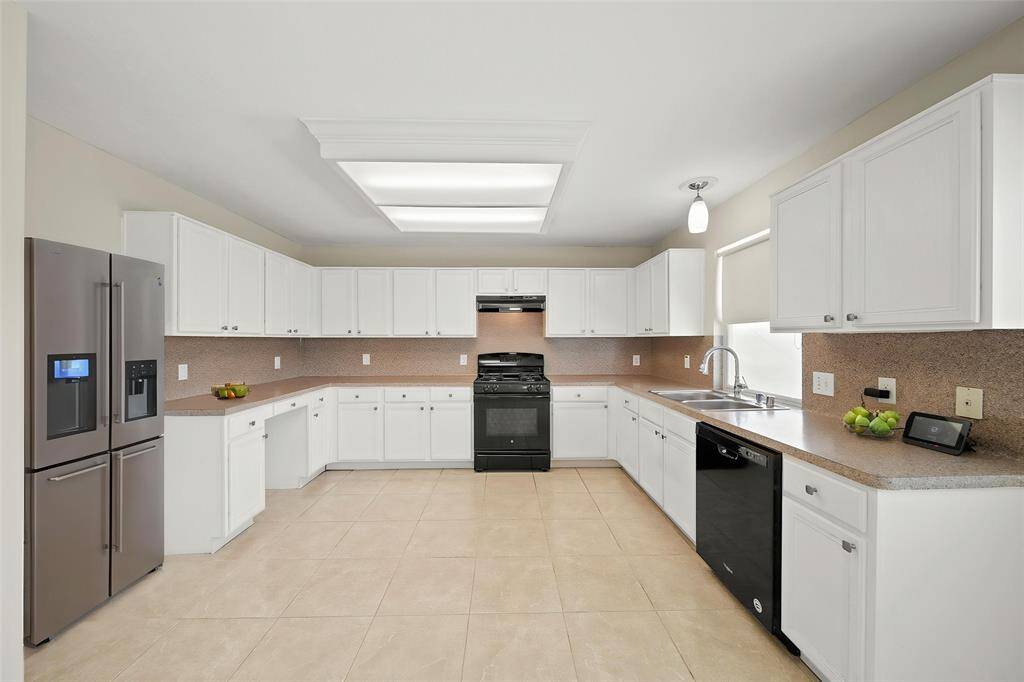Virtually Staged:Spacious and well lit kitchen with room for a breakfast area!