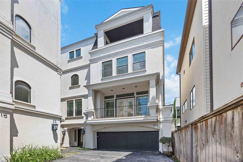 Experience refined living in this impeccably designed Montrose home, one of just three exclusive front-facing end units in a secure, gated community.