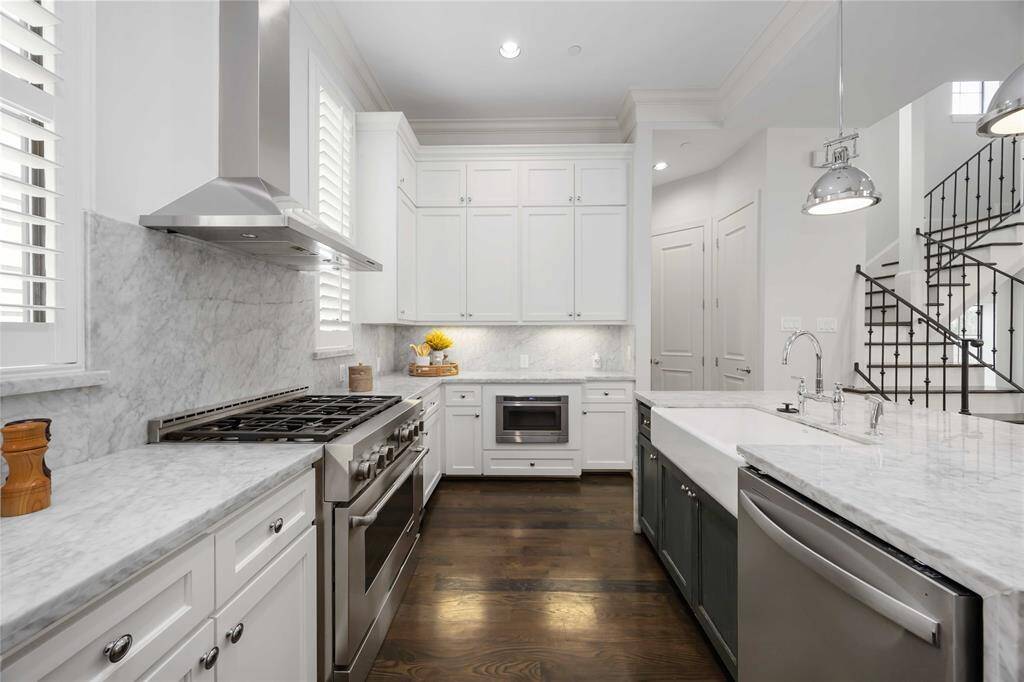You'll love the tremendous amount of counter space as well as an abundance of cabinets, which helps to keep those glistening counters clutter-free.