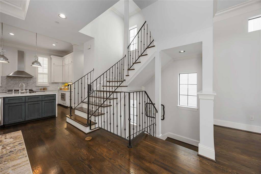 Look at the shine on those gorgeous floors! Head back down to the first floor or head to the third to check out an unbelievable primary suite.