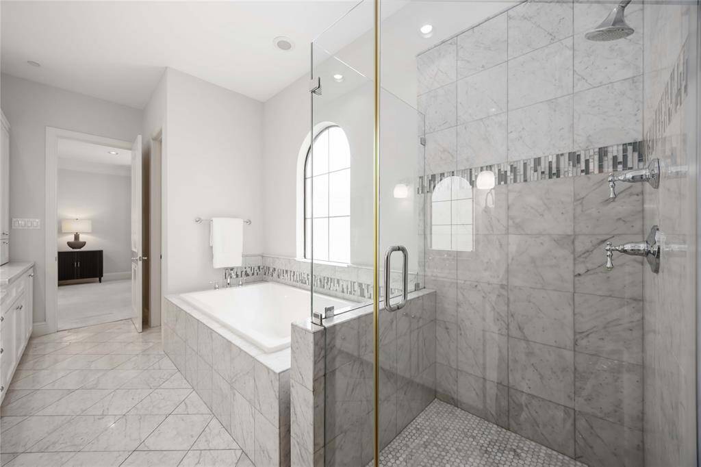 This primary bath is ideal for relaxation at the end of a long day.