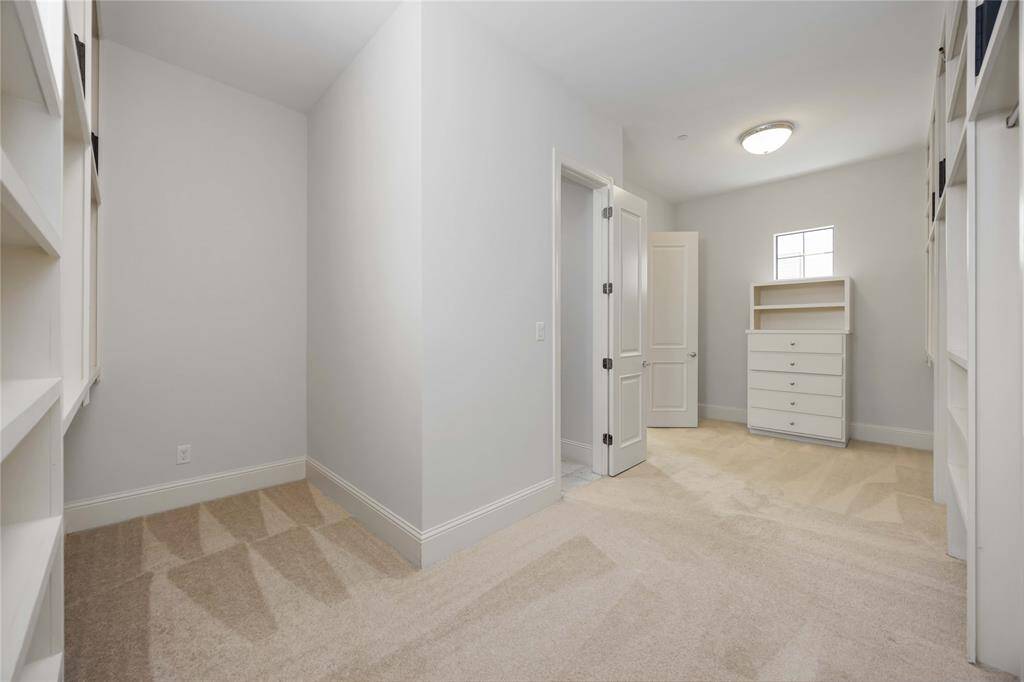 With this many built-ins, you really won't need separate dressers. Even if you do, you can add them in here and keep the bedroom feeling spacious and relaxing.