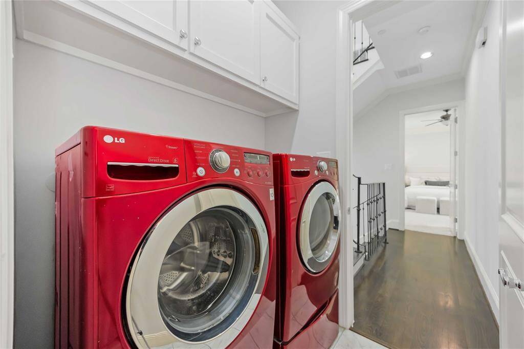 The laundry room is accessible from the 3rd-floor landing or through the back of the primary bedroom closet. Now that's brilliant!
