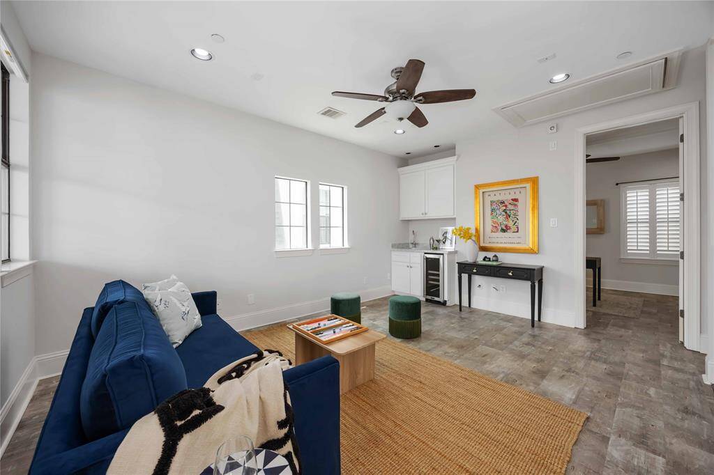 On to the 4th floor, where you'll find this sophisticated space. Set it up as a game room or a second living space. Either way, you'll love the corner wet bar and beverage cooler.