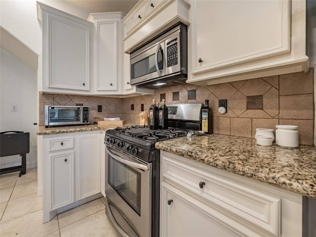 Kitchen with stainless steel appliances.