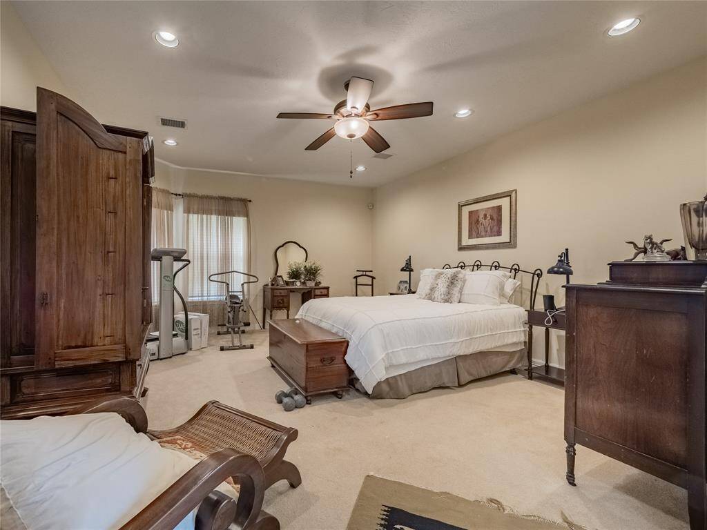 Primary bedroom suite with access to the back patio.