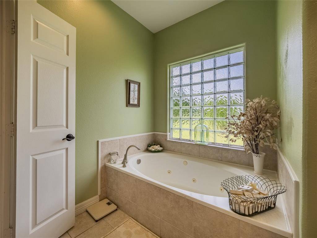 Primary bathroom jetted tub.