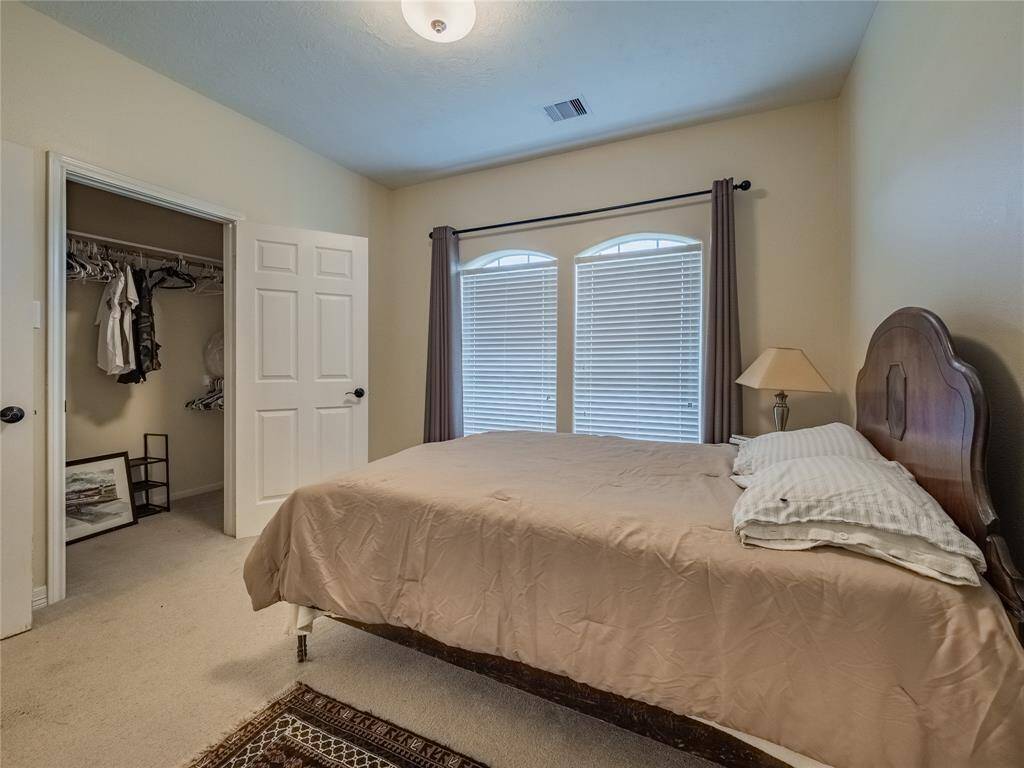 Second bedroom downstairs with walk in closet.