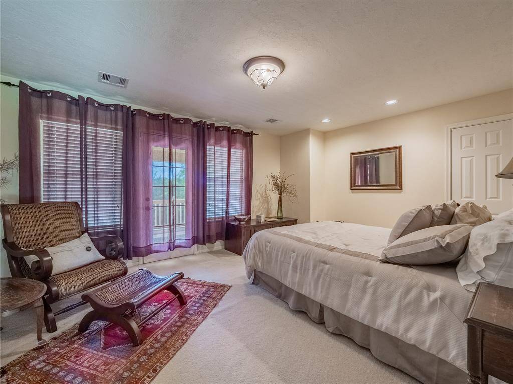 Extra large fourth bedroom with a balcony on the second floor.