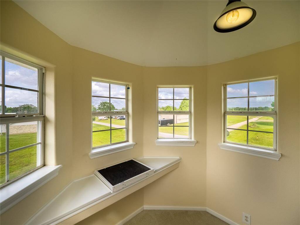 Third floor sunroom with views to the airfield.  Makes a great observation area.