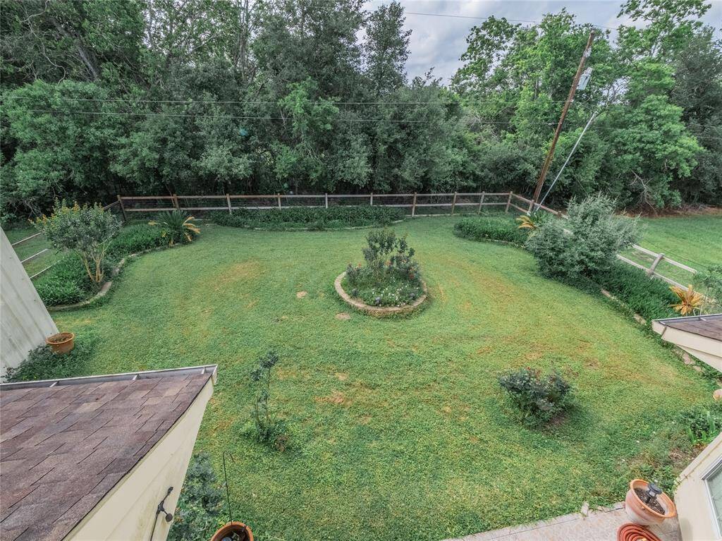 Beautiful tree lined backyard.