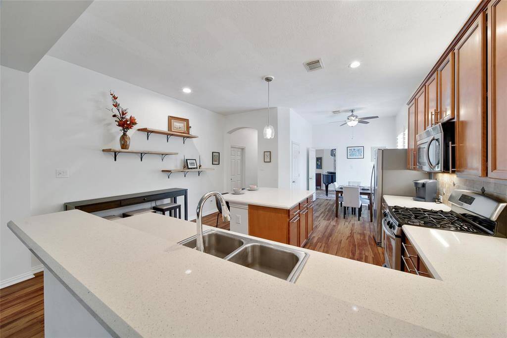 Expansive breakfast bar and countertops perfect for meal prep or casual dining.