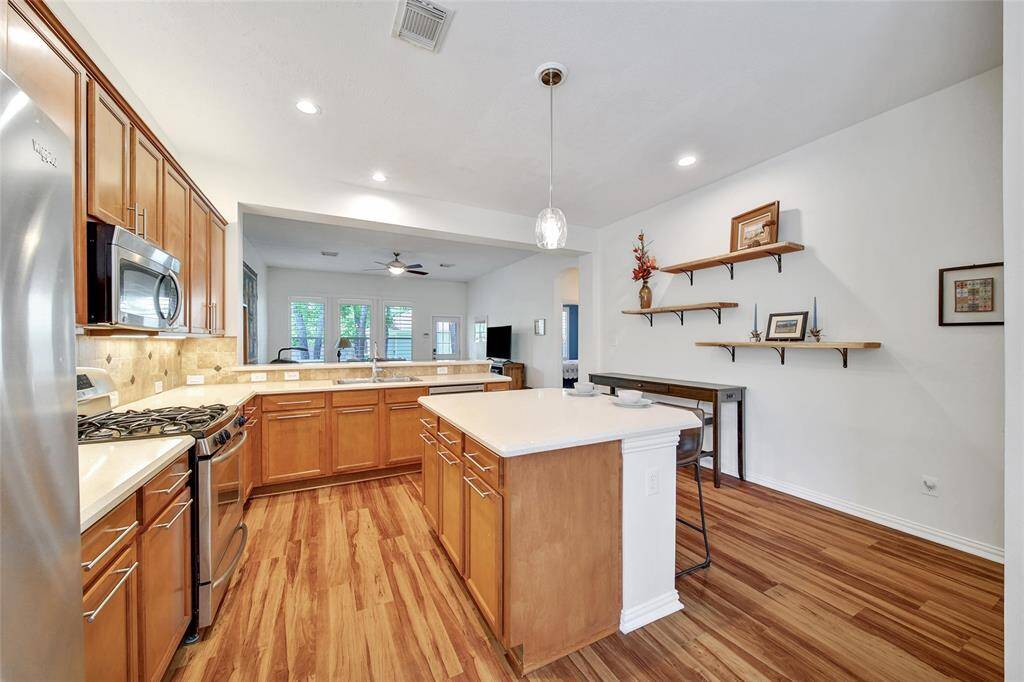 Open to the living and dining for easy entertaining.