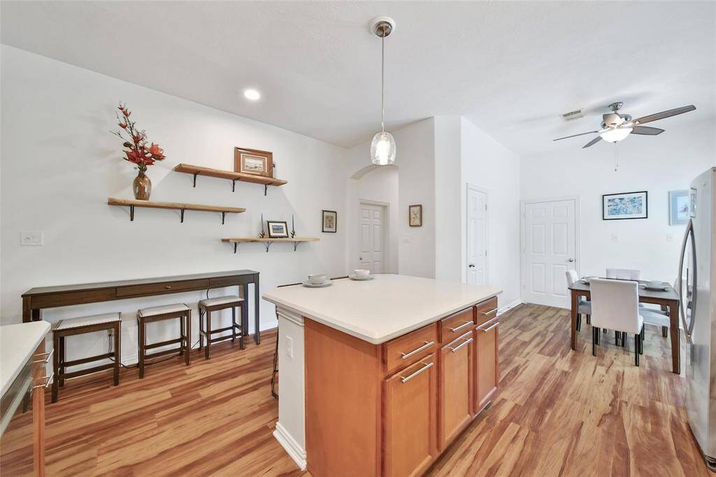 Center island offers seating and extra counter space.