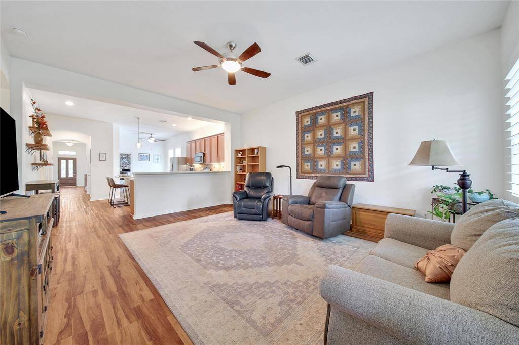 Seamless flow from living to kitchen and dining areas.