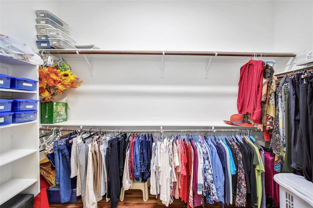 Spacious walk-in closet with plenty of room for wardrobes, shoes, and storage essentials