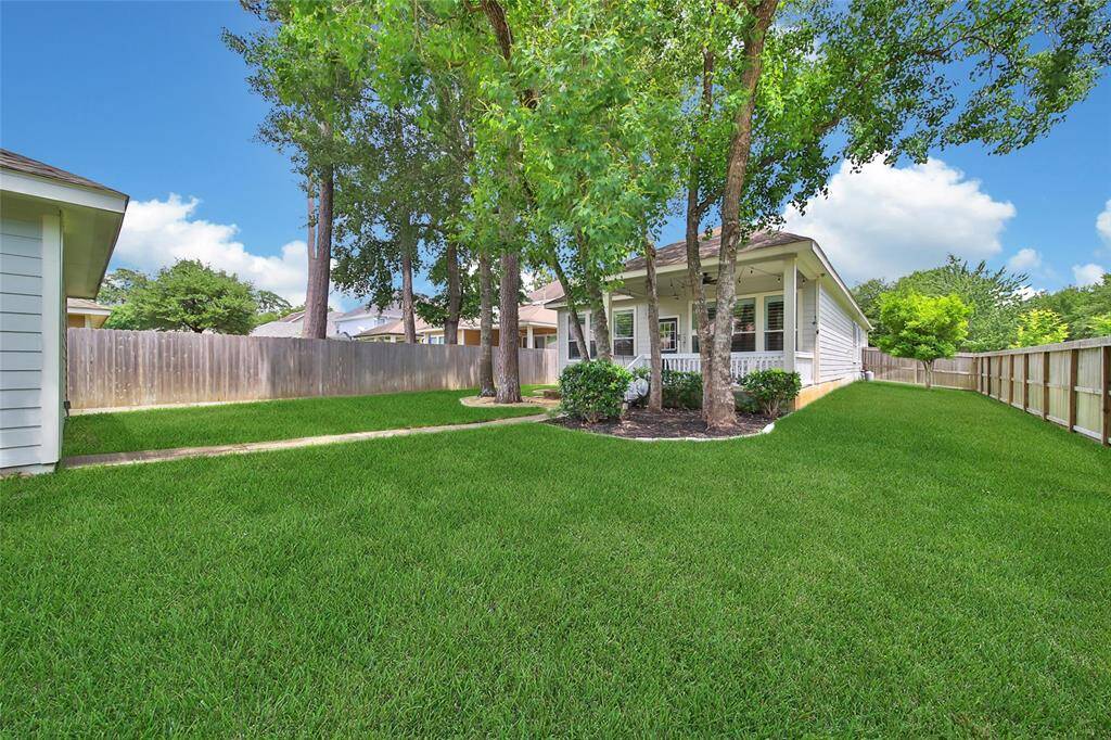 Fenced backyard with room to garden, play, or entertain.
