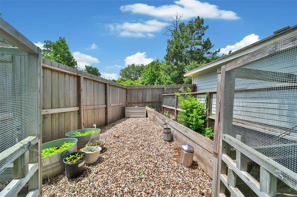 Charming fenced garden area — perfect for planting herbs, flowers, or veggies