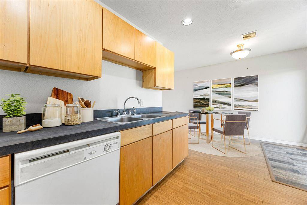 Efficient kitchen workspace showcasing durable countertop prep space, classic cabinetry for plenty of storage, and practical lighting, compact, functional, and ready for your favorite recipes.