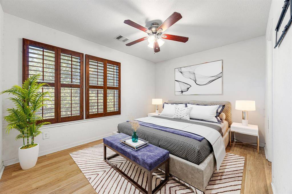 What a wonderful place to come home to, this stunning primary suite greets you with wood style floors, a warm custom paint, high ceiling, ceiling fan with lighting, lovely arched windows with blinds allowing in natural light brightening up this beautiful primary bedroom. *Virtually Staged