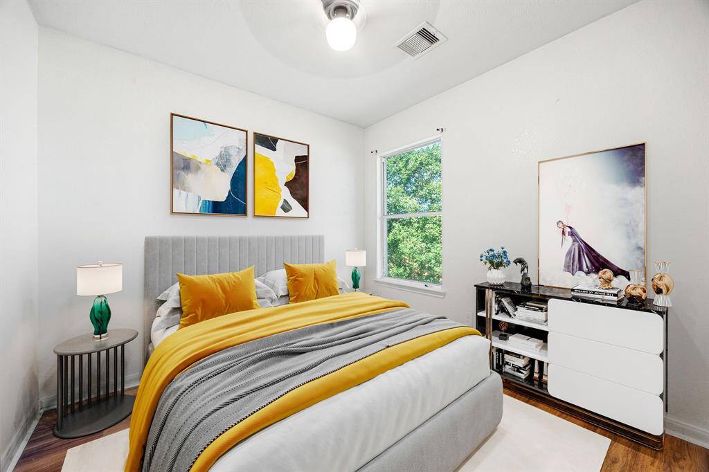 Cozy secondary bedroom featuring a neutral palette, bright natural light, and a roomy closet, perfect as a guest space, home office, or kid’s retreat. *Virtually Staged