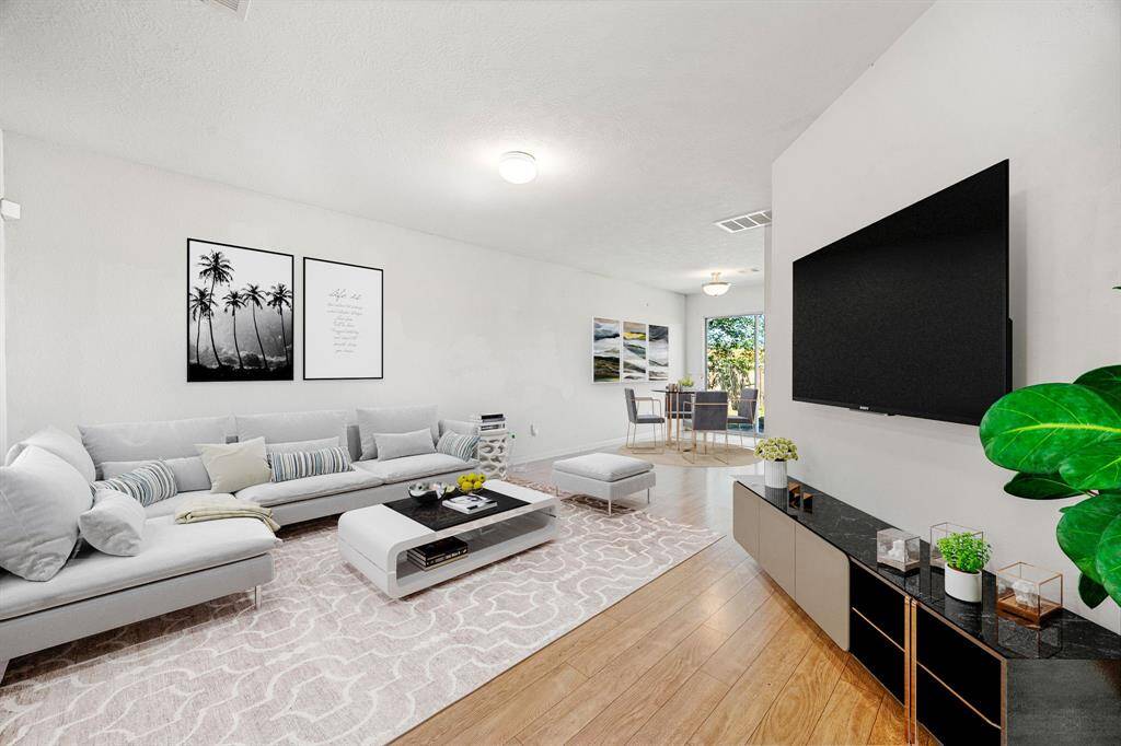 Come and unwind after a long day in this magnificent primary suite! This spacious room features plush carpet, warm paint, sitting area, high ceilings, beautiful custom ceiling fan and large windows with privacy blinds. *Virtually Staged