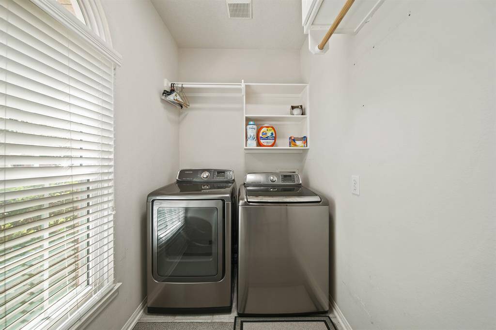 Laundry room with built in storage (unseen in photo)