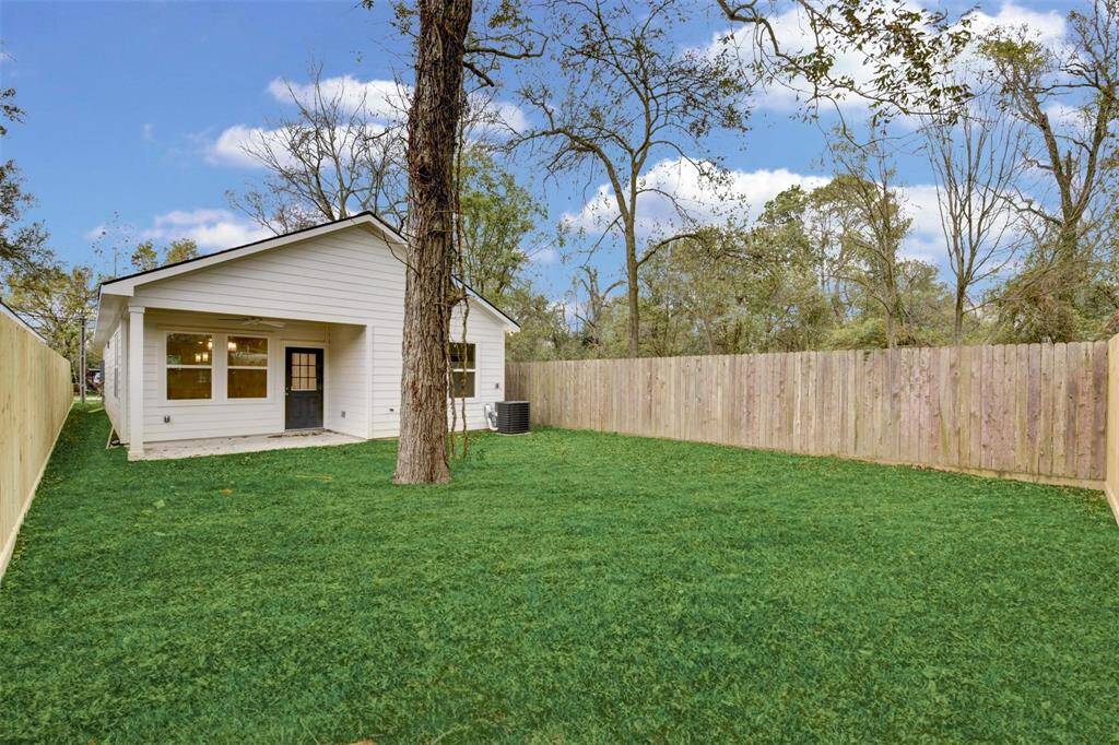 Discover this charming home with a spacious, fenced backyard featuring lush grass and mature trees—perfect for relaxation and outdoor fun.
