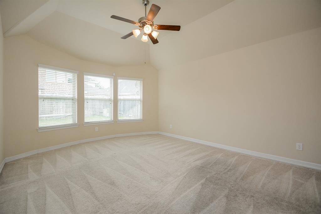 Here's your huge, naturally lit, elegant place of peace and repose: the primary ensuite bed/bathroom. Rich, tray ceiling, creamy hues on the walls and lush carpeting are welcoming canvases for your treasured furnishings!