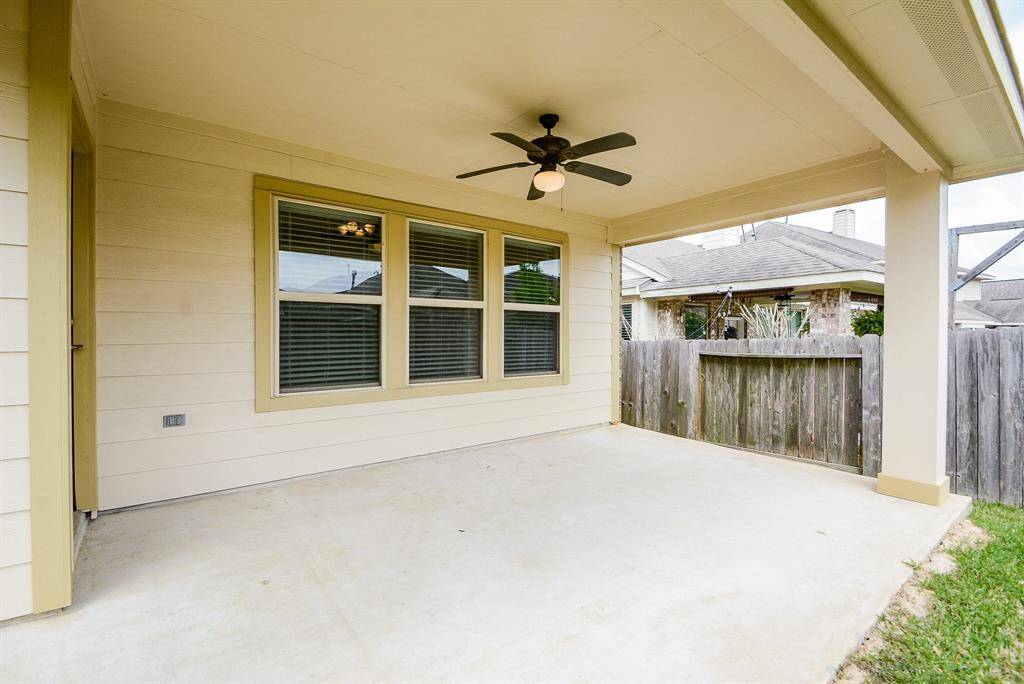 Bring your inside lifestyle, out! This is your large, covered patio/deck; roomy enough for cheerful seasonal pieces, a grill and fun! Note the wooden fencing that surrounds the property for added privacy and security.