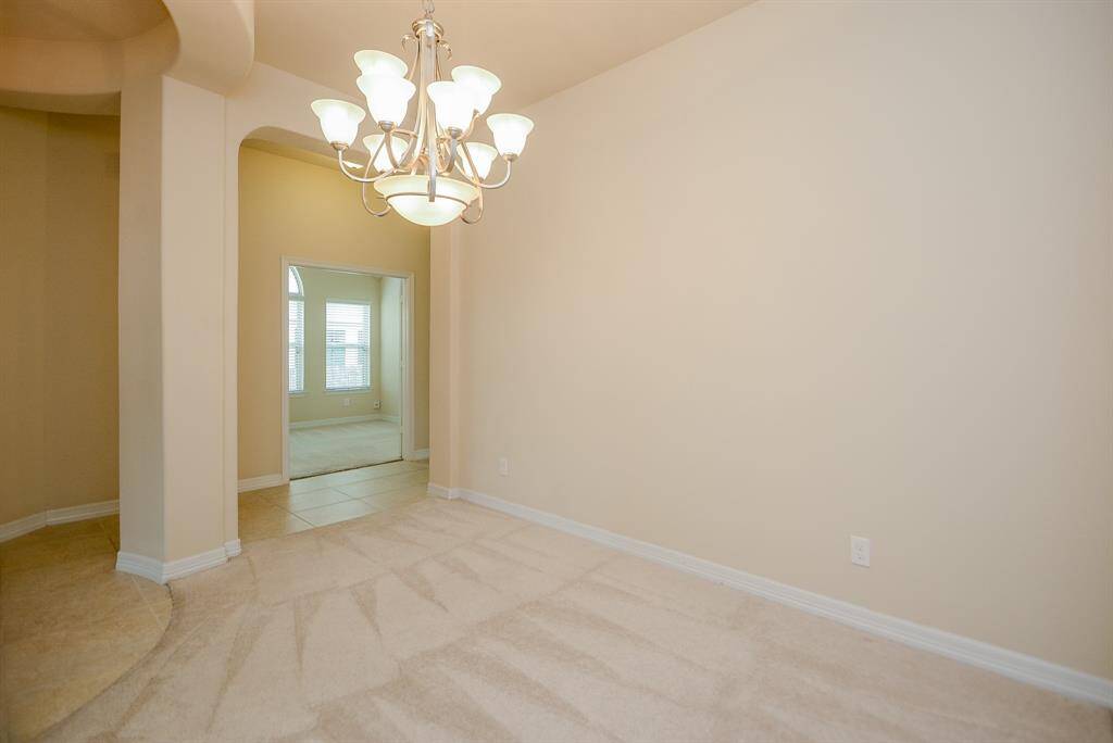 The beauty of the open concept floor plan is that YOU decide the purpose of each inch of space in this stunning home! This may likely be your choice for a formal dining area, with space galore!